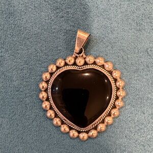 Large slightly heart shaped onyx pendant.